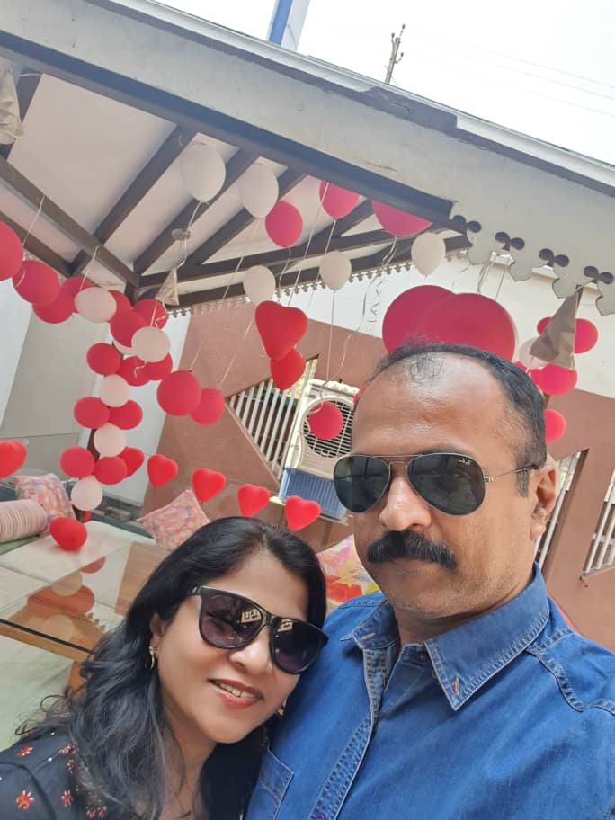 Rajesh relaxing with his wife