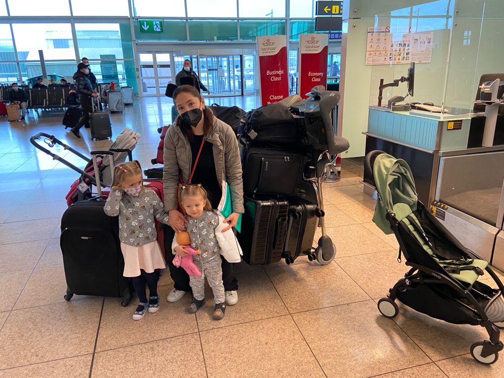 Mark's family checking in to fly from Madrid to the USA